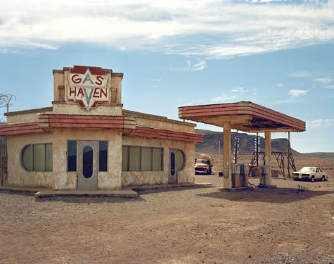 An American-style gas station is waiting for you on the highway out of Ouarzazate. It’s not a hallucination; rather it is the set used for the 2006 horror film “The Hills Have Eyes.”  The gas station sits along the highway that runs through the small commune of Amerzgane outside Ouarzazate, a city known as Hollywood’s “door to the desert.” Run Down Gas Station, Desert Gas Station Aesthetic, American Gas Station, Small Town Gas Station, The Hills Have Eyes 2006, Desert Horror, Desert Gas Station, Scrap Punk, Driving Into The Sunset