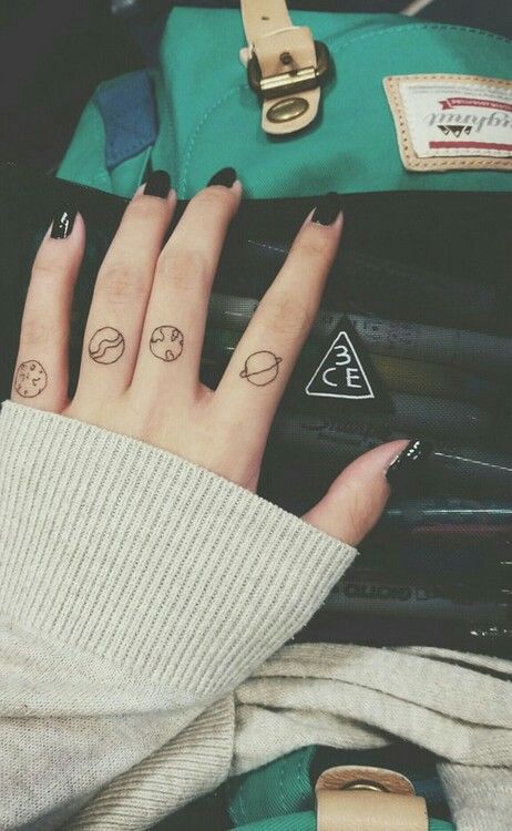 Solar system planet tattoos Tiny solar system planet tattoos on fingers Henne Tattoo, Tiny Finger Tattoos, Finger Tats, Planet Tattoos, Septum Piercings, Disney Tattoo, Geniale Tattoos, Finger Tattoo, Different Tattoos