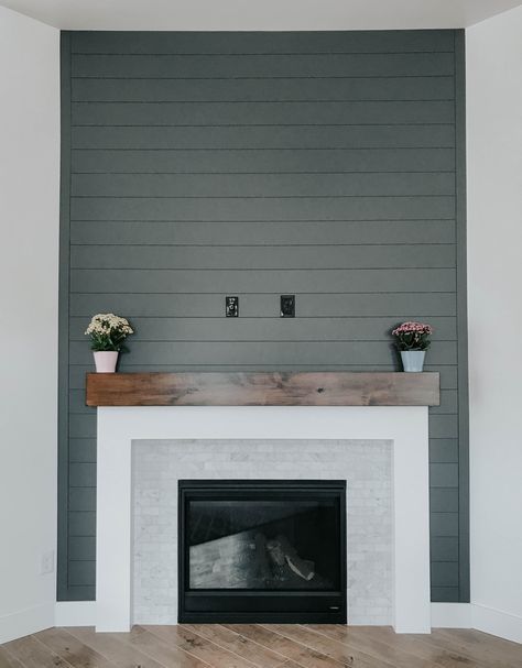 Old Wood Mantle, Framing Corner Fireplace, Grey Fireplace Surround, Simple Fireplace Surround, Stone And Shiplap Fireplace, Dark Shiplap, Corner Fireplace Makeover, Corner Fireplace Living Room, Fireplace Accent Walls