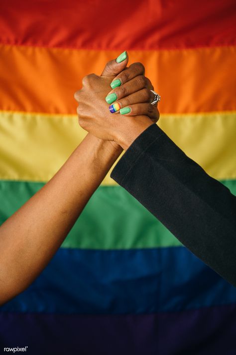 Gay couple holding hands in front of a rainbow flag signifying support and love | free image by rawpixel.com / Jira Pride Month Photoshoot, Pride Photoshoot Ideas, Lgbtq Photos, Pride Photoshoot, Flag Photoshoot, Pride Photos, Black Wlw, Couples Holding Hands, Pride Photography