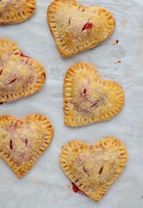 Strawberry Hand Pies {Heart Shaped!} – WellPlated.com Heart Shaped Strawberry, Strawberry Hand Pies, Cherry Hand Pies, Heart Shaped Food, Hand Pie Recipes, Black Cherries, Bridal Shower Desserts, Hand Pie, Shower Desserts