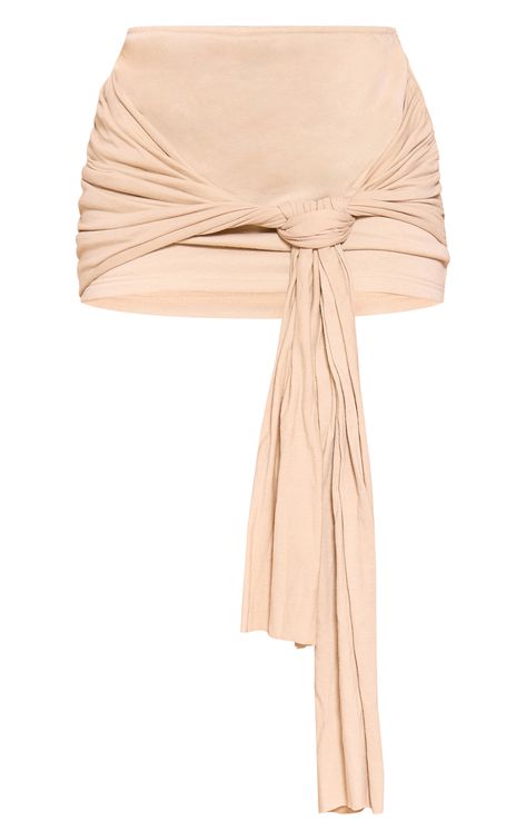 Take your look to the next level with this stone tie front knot drape mini skirt. This mini skirt is brought to you in a stone hue with a tie front, a mini length and a knot drape design, what's not to love? Take your look to the next level by styling this with a stone hue top, high heels and gold accessories for a vibe like no other. Length approx 33cm/13inch (Based on a sample size UK 8) Model wears size UK 8/ EU 36/ AUS 8/ US 4Model Height - 5ft 6inchp]:!mb-0inch>Category: BottomsProduct type: Mini SkirtColour: StoneMaterial: Loopback SweatDesign: PlainOccasion: Day Side Knot Skirt, Tie Front Skirt, Knot Top, Knot Skirt, Designer Drapes, Gold Accessories, Mini Skirts, Festival, Stone