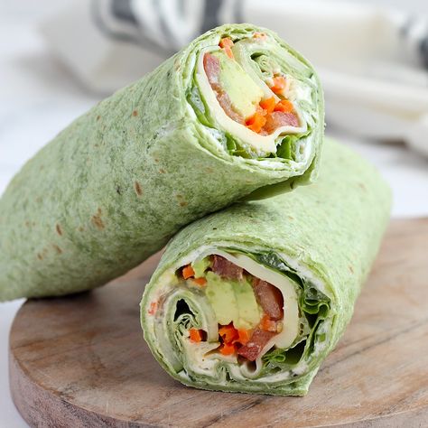 Our Veggie Wraps are made with a delicious, homemade herbed cream cheese and are packed with lots of fresh vegetables. It's a healthy and easy recipe that can be made ahead and are perfect for packed lunches! Green Wraps Tortilla, Cream Cheese Veggie Wrap, High Protein Veggie Wraps, Easy Veggie Sandwiches, Easy Vegetable Recipes Quick, Easy Veggie Wraps, Spinach Herb Wrap Recipes, Veggie Burrito Wraps, Vegetarian Lunch Wraps