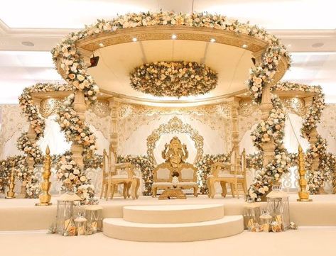 10 Trending Floral Mandap Decor For Floral Theme Wedding. Mandir Mandap Design, Hindu Ceremony Decor, Tamil Wedding Stage Decoration, Tamil Mandap, Gold Mandap Decor, Hindu Wedding Mandap Decoration, Mandap Designs Indian Indoor, Phera Mandap Decor, Tamil Wedding Decoration