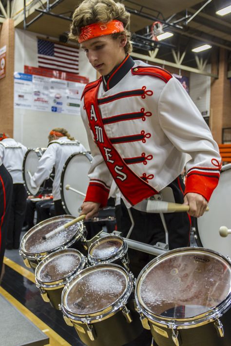 Miles Snyder plays the tenor drums during a performance of "Cowbell." The Ames High School marching band put on a final performance during the Marching Band Spectacular on Monday, Oct 19 at Ames High School. The band played different songs from their various performances, including Mr. Roboto and Mask of Zorro. Different players and supporters were also honored during the event. This was the last performance of the marching band of the season. Tenor Drums Marching Bands, Marching Band Percussion, Marching Band Drumline, Marching Band Outfits, Tenor Drum, Mask Of Zorro, Circus Ideas, Mr Roboto, Texas High School