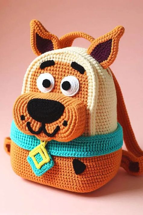 The Scooby-Doo crochet backpack is an adorable and functional accessory that brings to life the beloved character from the iconic cartoon. Scooby Doo Crochet, Crochet Things To Sell, Backpack Patterns, Animal Purse, Iconic Cartoon, Crochet Backpack Pattern, Stitch Backpack, Animal Backpacks, Purse Ideas