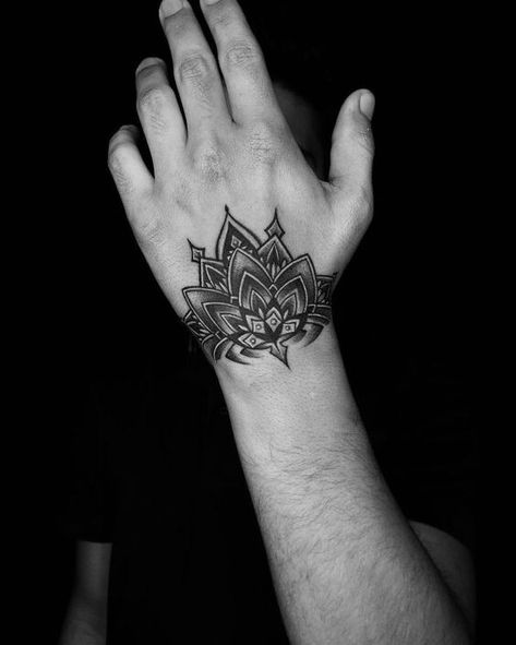 Unique Men’s Wrist Tattoos: Ideas for Personal Style and Expression Mandala Tattoo Designs Men, Mandala Tattoo Design On Hand, Lotus Hand Tattoo Men, Small Mandala Tattoo Men, Mandala Tattoo Design Mens Hand, Best Hand Tattoos Men Unique, Half Hand Tattoo Men, Hindi Tattoo Men, Mandala Hand Tattoo Men