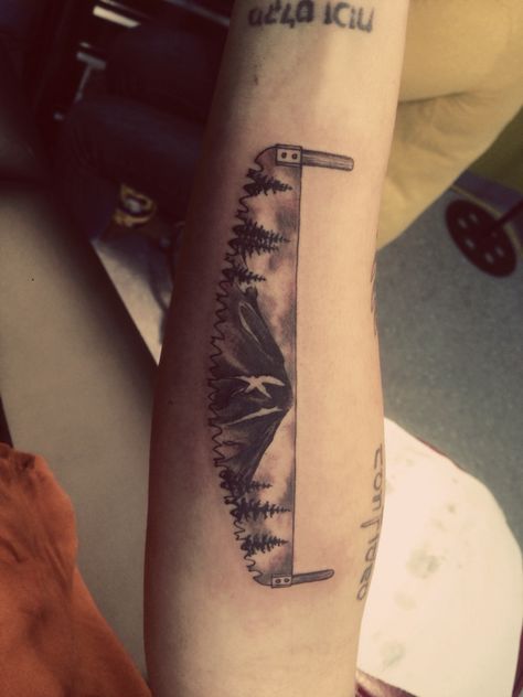 Saw. Mountain. Trees. Logging. Tattoo. Lumberjack Tattoo Ideas, Crosscut Saw Tattoo, Hand Saw Tattoo, Logging Tattoo Ideas, Log Truck Tattoo, Rustic Tattoo Men, Woodworker Tattoo, Outdoorsman Tattoo, Logging Tattoo