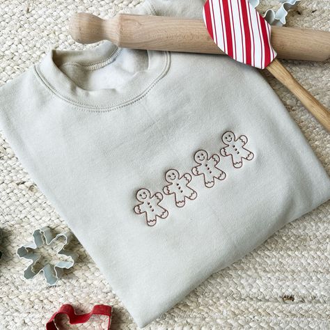 Embrace the spirit of the holidays with a touch of sweetness and a dash of charm! Our Gingerbread Man Crewneck is not just a sweatshirt; it's a wearable work of art that spreads joy with every stitch! Make a statement this season and let your festive spirit shine bright with this delightful addition to your winter wardrobe. Sample shown in SAND with CHESTNUT THREAD. This design is protected under intellectual property copyright. Art that is created is safeguarded by intellectual property copyrig Gingerbread Man Gift, Simple Sweatshirt, Men Crewneck, Christmas Crewneck, Gingerbread Men, Embroidery Sweatshirt, Traditional Christmas, Embroidered Sweatshirt, Embroidered Hoodie