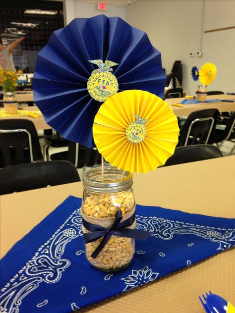 FFA Banquet centerpieces. Had them with jars of wild yellow flowers-inexpensive! Ffa Barnwarming Decorations, Banquet Decorations Table, 4h Banquet Decorations, Ffa Balloon Arch, Ffa Party Decorations, Banquet Centerpieces Inexpensive, Ffa Photo Booth, Ffa Banquet Table Decorations, Ffa Table Decorations