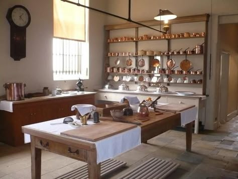 A Downton Abbby-inspired kitchen featuring a regulator wall clock.  #regulator #wallclock  #DowntonAbbey Edwardian Servants, Screenplay Ideas, Downton Abbey Decor, Servants Quarters, Castle Kitchens, Upstairs Downstairs, Island Table, Victorian Kitchen, Farmhouse Dining Table