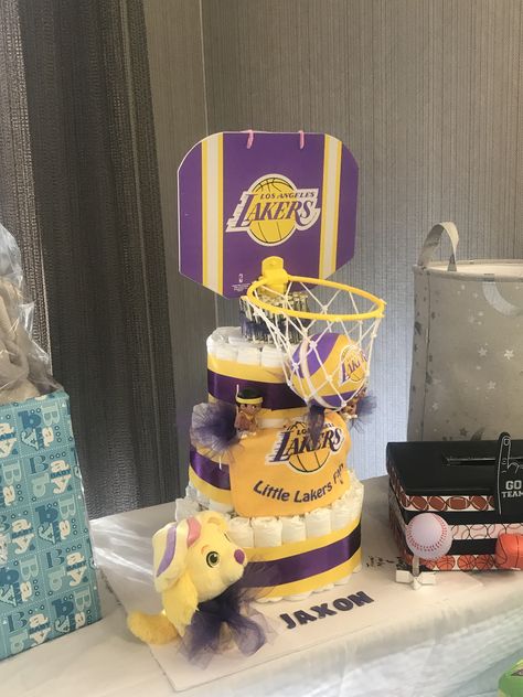 Lakers Diaper Cake #lakers #diapercake Lakers Baby Shower Theme, Basketball Theme Baby Shower, Basketball Baby Shower, Hatch Baby, Sports Baby Shower Theme, Basketball Theme Party, Baby Q Shower, Basketball Baby, Baby Q