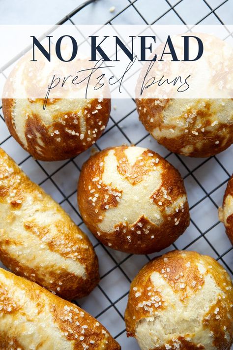 These no-knead pretzel buns are perfectly soft and sturdy inside with a golden, crispy exterior. Use them as a base for hamburgers, hot dogs, brats, and pretty much any sandwich you can think of! Pretzel Sandwich Buns, Pretzel Bun Sandwich Ideas, Pretzel Buns Recipe, Pretzel Buns Sandwich, Pretzel Bun Recipe, Pretzel Sandwich, Pretzel Buns, Pretzel Dogs, Baked Pretzels