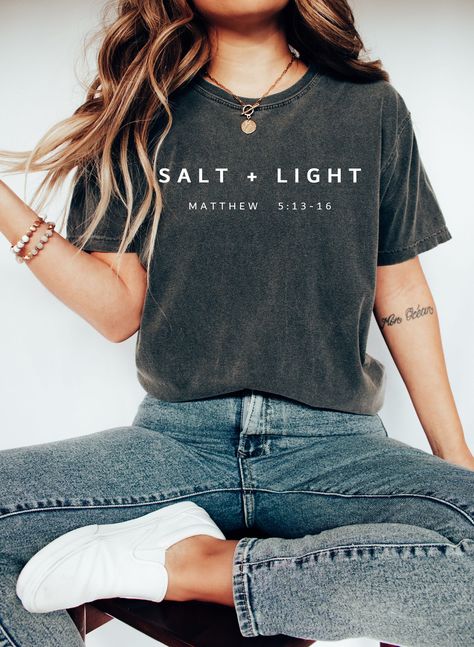 Salt + Light Matthew 5:13 Shirt,Bible Verse Shirt,Christian Shirt,Christian Apparel,Salt and Light,Christian sweat,Be Salty,Gıft For Her We design trendy sweatshirts that you can use in every important day of your life. We produce beautiful and quality designs that can be used in all kinds of activities that you will do with your family or friends. These designs will offer you and your environment a unique complement. We are very excited to bring you our high quality and soft, trendy sweatshirt. Matthew 5 13, Salt Light, Trendy Sweatshirts, Christian Shirts Designs, Word Shirts, Salt And Light, Bible Verse Shirt, Christian Apparel, Christian Shirt