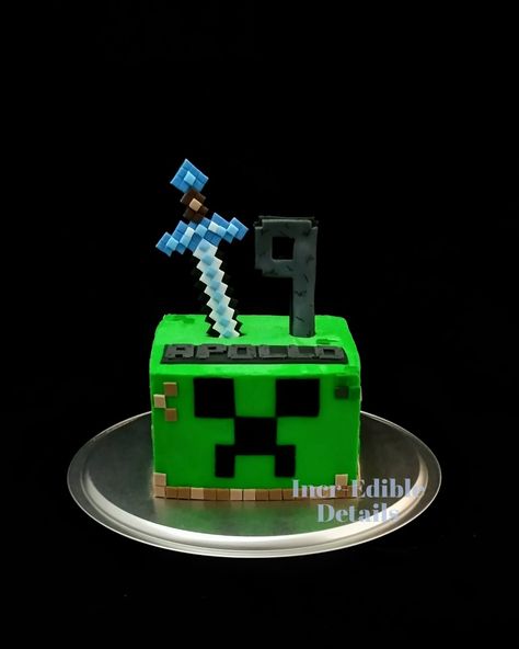 Minecraft creeper style birthday cake with fondant sword topper and details Minecraft Cake Without Fondant, Minecraft Creeper Cake Ideas, Minecraft Creeper Birthday Cake, Creeper Birthday Cake, Minecraft Square Cake, Creeper Cake Minecraft, Creeper Minecraft Cake, Minecraft Dungeons Cake, Minecraft Birthday Cake For Boys