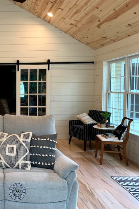 Scott and Amy painted their living room's shiplap walls white, and left the ceiling unfinished to add extra warmth to the space. It is certainly a lovely and welcoming room!!! Loving the ambrosia maple flooring as well! So much character! White Walls Wood Ceiling Cabin, Shiplap On Vaulted Wall, Shiplap In Family Room, White Plank Walls Living Room, Cedar Ceiling Shiplap Walls, Shiplapped Living Room, White Walls Pine Trim, Sunroom Shiplap Walls, White Wood Walls Living Room