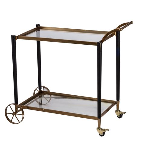 The Classic Chic Gold Serving cart features two tiers of safety-tempered glass, ideal for tea parties or even just serving your favorite beverages in an elegant and easy manner. The gold-polish railing is elegant and timeless, and also helps to prevent slipping. In subtle colors and rich neutral tones, this cart will add the perfect touch to your dining room decor. - Gold 36-Inch Serving Cart - Unique accent adds a flair of classic chic style to your home - Metal cart with glass and wood accents Classic Home Interiors, Bar Cart Black, Gold Cart, Inviting Dining Room, Metal Cart, Classic Chic Style, Gold Bar Cart, Serving Bar, Classic Bar