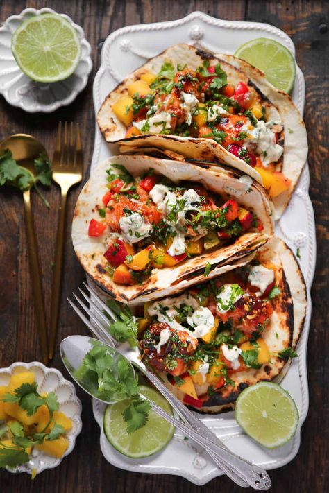 Salmon Tacos with Mango Peach Salsa on a white platter Crossfit Meals, Salmon Recipes With Mango Salsa, Salmon Tacos With Mango Salsa, Mango Salsa Fish Tacos, Cajun Salmon Tacos With Mango Slaw, Peach Mango Salsa, Salmon With Mango Salsa, Smart Eating, Julia's Album