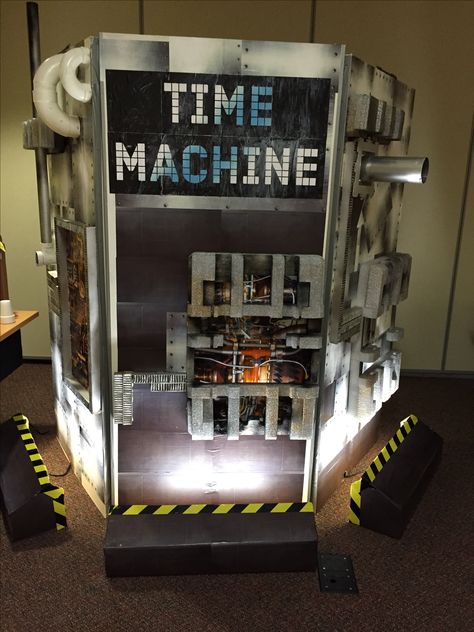 Time machine made from closet door panels, Mod Podge and paper printouts, cardboard, and foam scrap. Spray paint and "caution" duct tape accents. Backside is set up with hooks, mirror, and fixtures for costume changing on stage. Diy Time Machine, Time Travel Machine, Machine Image, Vbs Themes, Door Picture, Vacation Bible School, Childrens Church, Time Machine, Diy Door