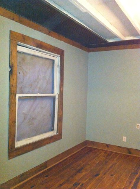 Base board and ceiling trim are barnwood. I left the rafters exposed and laid OSB on top in the attic. I used barn tin around the perimeter on the ceiling. Pallet Window Trim, Bathroom Remodel Diy Budget, Wood Ceiling Trim, Window Trim Farmhouse, Wood Windows White Trim, Rustic Window Trim, White Window Frames, Wood Window Trim, Baseboard Ideas