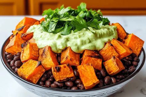 Try these delicious roasted sweet potato taco bowls with black beans and creamy avocado crema for a healthy, flavorful, and easy meal! Vegetable Burrito, Potato Taco Bowl, Avocado Lime Crema, Taco Bowl, Sweet Potato Tacos, Avocado Crema, Roasted Sweet Potato, Meatless Recipes, Taco Bowls