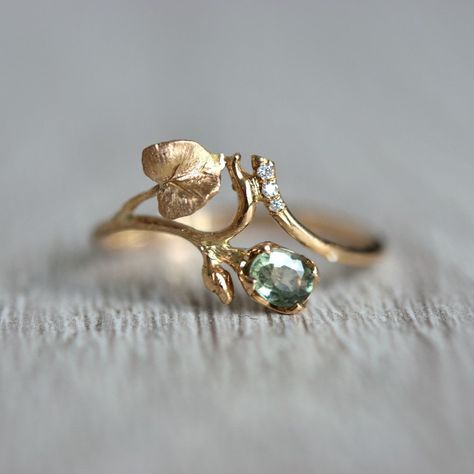 Truly romantic, delicate sapphire and diamond ring with the botanical motif of green flower bud and twig with leaves. This sapphire and diamond leaf wedding ring is handmade with special care for details. I created it with the thought of women who love nature, going to the woods, or hiking mountains.  And if you live far away from it, in a crowded city, the look at the jewelry piece will bring harmony to your life peace and quiet.   And a few details about the stone, material, shipping, and pack Engagement Rings Stones Not Diamond, Wedding Ring Nature Inspired, Plant Inspired Engagement Rings, Plant Engagement Ring, Elven Engagement Rings, Cottagecore Rings Engagement, Four Leaf Clover Ring, Lotr Inspired Engagement Rings, Vintage Wedding Ring Set