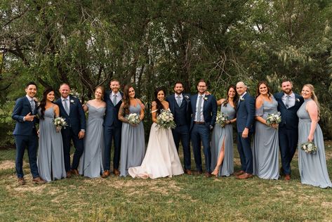 Bridesmaids in dusty blue dresses and groomsmen in navy blue suits for a Fort Collins Wedding in Colorado. This dusty blue themed Colorado wedding had an outdoor wedding ceremony and a tented wedding reception. Navy Groomsmen, Navy Blue Wedding Theme, Blue Groomsmen, Light Blue Bridesmaid Dresses, Light Blue Bridesmaid, Dusty Blue Dress, Navy Blue Bridesmaids, Pictures Outfits, Wedding Party Outfits