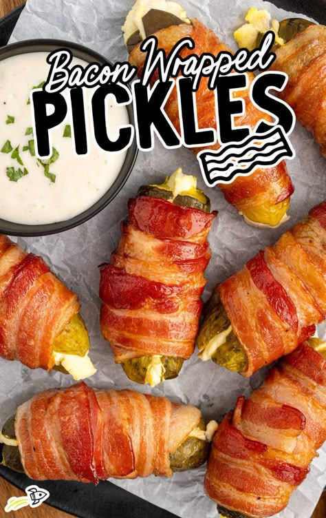 a bunch of Bacon Wrapped Pickles with a bowl of dipping sauce Bacon Wrapped Pickles Baked, Pickle Wrapped In Bacon, Pickle Bacon Wraps, Pickle Poppers Bacon Wrapped, Bacon Wrapped Hot Dogs Air Fryer, Dill Pickle Bacon Shots, Bacon Wrapped Pickles Oven, Bacon Wrapped Pretzel Rods, Smoked Pickle Poppers