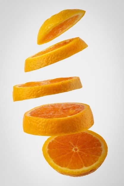 Free photo floating slices orange with c... | Free Photo #Freepik #freephoto #orange #orange-peel #fruit-slice #orange-fruit Orange Twist Garnish, Peeled Orange, Sliced Orange, Life Reference, Posts Ideas, Fruits Photos, School Painting, Orange Twist, Orange Slice