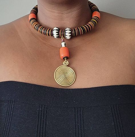 100% handcrafted using African beads. The necklace makes a perfect gift to loved ones. It will make you look bold and beautiful. **Buy multiple items and pay shipping for 1 item only.The rest ships free. More neckleces here; https://www.etsy.com/shop/TribalTess?ref=seller-platform-mcnav&section_id=21306083 Back to my shop; https://www.etsy.com/shop/TribalTess?ref=seller-platform-mcnav African Trade Bead Jewelry, African Beaded Necklace, Leather Beaded Necklace, African Inspired Jewelry, African Jewellery, Large Bead Necklace, African Beads Necklace, Artsy Jewelry, Necklace African