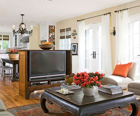 I like the idea of separating the LR and DR with a TV cabinet. This antique cabinet is used as a shelf, a media center, and a room divider.  Even though the cabinet is in the middle of the room, because it doesn't stretch to the ceiling, the zones still feel like one space. Family Friendly Living Room, Furniture Placement Living Room, Furniture Placement, Trendy Living Rooms, Open Living Room, Tv Furniture, Family Room Design, Family Rooms, Living Room Tv