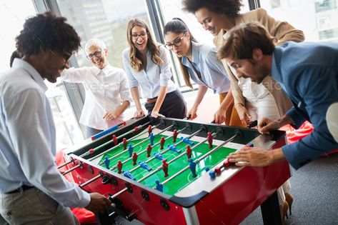 Employees playing table soccer indoor game in the office during break time by nd3000. Employees playing table soccer indoor game in the office during break time to relieve stress from work #Sponsored #soccer, #indoor, #game, #Employees Unique Office Spaces, Gym Activities, Future Office, Office People, Recreational Room, Lounge Space, People Having Fun, Office Games, Foosball Table