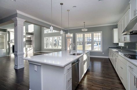 Contemporary kitchen with arctic white quartz countertops, white cabinets, gray walls and tile backsplash Blue Gray Kitchen Cabinets, Grey Painted Kitchen, Cabinets Gray, White Cabinets White Countertops, Grey Kitchen Walls, White Kitchen Ideas, Grey Blue Kitchen, Best Kitchen Colors, Light Grey Kitchens