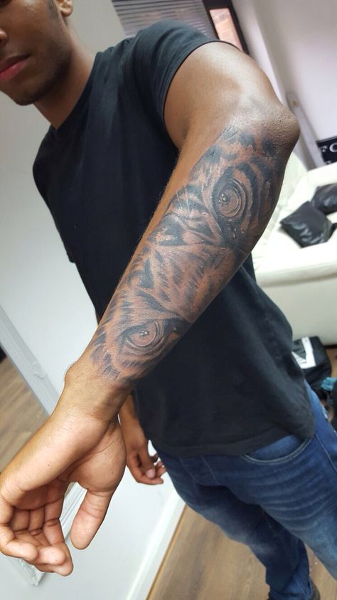 Tiger Eye Forearm Tattoo, Animal Eyes Tattoo Forearm, Eye Of A Tiger Tattoo, Black Panther Eyes Tattoo, Eyes On Forearm Tattoo, Eye Tiger Tattoo, Tiger Arm Tattoo Men, Tigers Eye Tattoo, Lion Eyes Tattoo Forearm