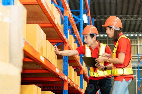 Man worker hold clipboard document talking to woman in warehouse store. Male and female engineers people wear safety hard helmet and vest  checking storage box parcel in factory Female Engineer, Factory Worker, Wedding People, Cityscape Photos, Clipboard, Marketing Design, Heart With Arrow, Male And Female, Custom Branding