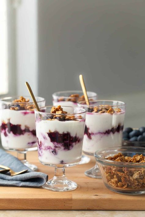 Enjoy these easy blueberry parfaits made with roasted blueberries, creamy yogurt, and crunchy granola for breakfast, a snack, or dessert. Use dairy-free yogurt for a vegan option! Roasted Blueberries, Blueberry Yogurt Parfait, Strawberry Cucumber Salad, Gluten Free Overnight Oats, Strawberry Cucumber, Vegetarian Brunch, Blueberry Yogurt, Creamy Yogurt, Parfait Breakfast