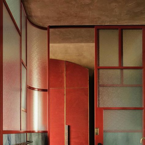 Flack Studio on Instagram: "The Terrace House’s main bathroom sits off the main bedroom which we recently shared.   While it’s a small space, the deep red steel frame feels like a conservatory to the main bedroom, showcasing the leather-lined robes.   Photography: @smartanson  Editorial Styling: @joseph_gardner  Landscape: @florian____wild  Builder: @grwdevelopments  #terracehousebyflack #vogueliving" Flack Studio Bathroom, Red Windows, Crittal Doors, Flack Studio, Surf Coffee, Stained Window, Restaurant Bathroom, Editorial Styling, Red Bathroom