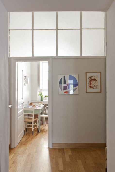 The passage into the kitchen, where architectural glass forms the top half of the dividing wall. Roman Kitchen, Borrowed Light, Glass Room Divider, Boss Office, Glass Room, Clerestory Windows, Glass Doors Interior, Casa Vintage, Interior Windows