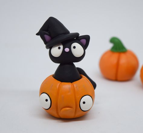 If they fit, they'll sit and this pumpkin has made a great spot for this little black cat. She's found a witch's hat that she thinks is very fetching, she's probably right. This lovely little black cat will bring good luck* to all that own her. She makes a lovely gift for Halloween. *not guaranteed Clay Projects Kids, Fimo Halloween, Polymer Clay Halloween, Pumpkin Ornament, Halloween Ghost Decorations, Fairy House Crafts, Halloween Clay, Cerámica Ideas, Air Dry Clay Projects