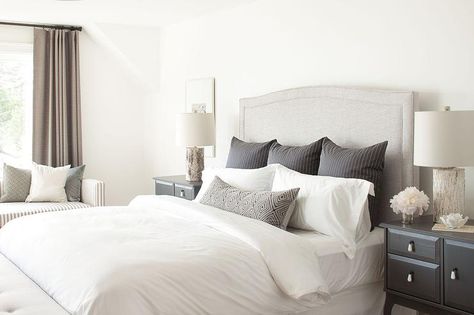 Chic bedroom features a gray linen camelback headboard on bed dressed in black pinstripe pillows flanked by black nightstands topped with birch wood lamps. Modern Farmhouse Bedroom Master Suite, Bed Pillow Arrangement, Bedroom Tour, White Bedroom Design, Modern Farmhouse Bedroom, Transitional Bedroom, Casa Country, Bedroom Bliss, Pillow Arrangement