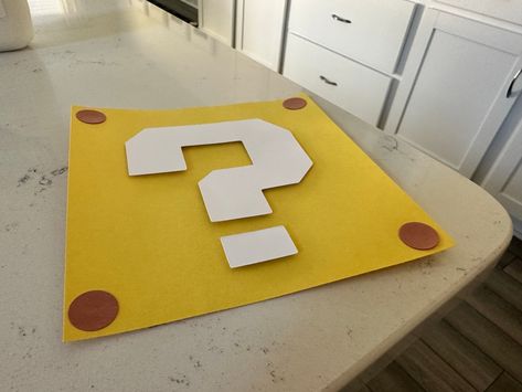 Mario Box Question Mark, Question Block Mario, Mario Blocks Diy, Mario Question Block Costume, Mario Question Mark, Diy Mario Decorations Birthday Party Ideas, Mario Question Mark Printable, Mario Question Block, Super Mario Decorations Diy