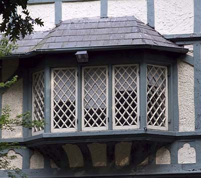 Oriels—framed in wood, stone, or masonry—were defining features of Gothic Revival and Tudor-style structures. A close relative of the bay window, oriels project from upper-story walls, where they are cantilevered or supported by brackets or corbels. French Tudor, Victorian Bay Window, Oriel Window, Gable Window, Victorian Windows, Gothic Revival Architecture, Closet Addition, Copper Roof, Tudor Style Homes