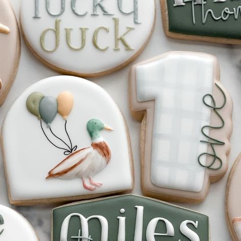 Jess Linstra on Instagram: "Miles is one lucky duck 🦆  #cookies #njcookies #cookiesofinstagram #decoratedsugarcookies #firstbirthdaycookies #oneluckyduck" One Lucky Duck Birthday Party Cookies, Mallard Duck Baby Shower Cookies, Mallard Duck 1st Birthday, Duck Duck Deuce Birthday, One Silly Goose Birthday Cookies, One Lucky Duck Food Ideas, 1 Lucky Duck Birthday, Mallard Duck Cookies, One Silly Goose Cookies