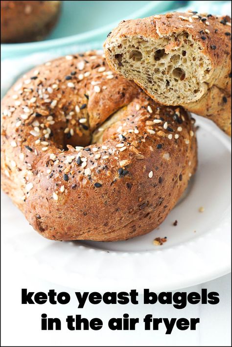 plates with a keto yeast bagel made in air fryer and text Keto Air Fryer Bagels, 2 Ingredient Bagels With Almond Flour, Yeast Bagels, Keto Bagels 2 Ingredients, Keto Bagels Almond Flour, Air Fryer 2 Ingredient Bagel, Air Fryer Bagels, Best Low Carb Bread, Low Carb Bagels