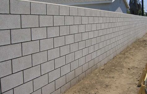 Calculate how many concrete blocks are needed for your wall or building project. Find how to estimate concrete block construction projects. Concrete Fence Wall, Cinder Block House, Concrete Block Retaining Wall, Fence Wall Design, Types Of Bricks, Compound Wall Design, Concrete Block Walls, Cinder Block Walls, Covered Back Patio