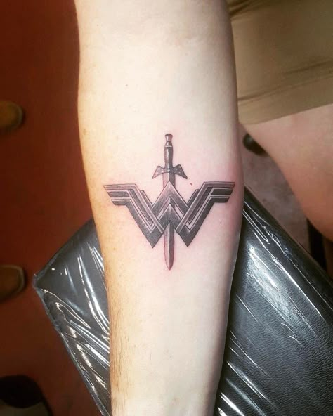 Wonder Woman Tattoo | Tattoo Ideas and Inspiration Wonder Woman Cuff Tattoo, Wonder Woman Symbol Tattoo, Small Wonder Woman Tattoo, Safety Pin Tattoo, Wonder Woman Tattoo, Tattoo Black And White, Cuff Tattoo, Blue Rose Tattoos, Mommy Tattoos