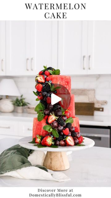 Giustina | DIYs • Recipes • Home Inspiration on Instagram: "Like + Comment “Link” to instantly get the links, recipe, & details in your DM.   I’m so excited to share this Watermelon Cake!  And don’t worry, my 2-year-old son and 92-year-old grandmother greatly enjoyed the extra watermelon.  They both sat and snacked on it while watching me build this cake made entirely of fruit and topped with more fruit and fresh mint leaves.  I secured the watermelon cake with long wooden skewers and attached the fruit with wooden toothpicks.  We had a large family gathering with Roger’s family that night and cutting it was as simple as slicing and serving.  The toothpicks in the fruit can be removed when serving or left in the berries to be used/served as finger food.  What’s your favorite fruit will you Extra Watermelon, Wooden Skewers, Fruit Pudding, Fruit Creations, Watermelon Cake, Fruit Decorations, Fun Foods, Fresh Mint Leaves, Fruit Platter