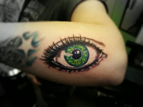 Eye tattoo by Wes Hawkins of New Age Tattoo in Marquette MI Colored Eye Tattoo, Green Eyes Tattoo, Green Eye Tattoo, Multiple Eyes Tattoo, Eye World Tattoo, Eye That Sees Everything Tattoo, Green Eye Tattoo Realistic, New Age Tattoo, Third Eye Forearm Tattoo