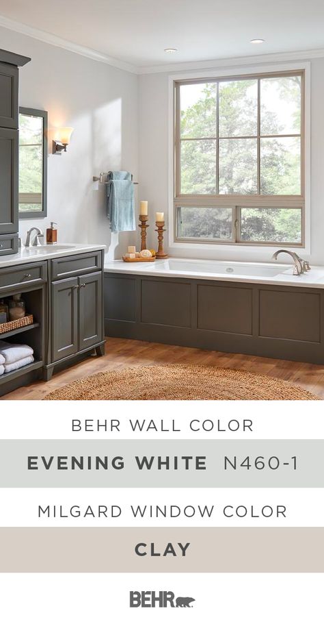 A neutral color palette and classic home decor accents create a tranquil style in this master bathroom. And it all starts with Behr Paint in Evening White paired with these Hermosa® Series Picture and Slider Vinyl windows, by Milgard, in Clay. Click below for full paint color details to learn more. Office Paint Colors Behr, Paint Colors Behr, Home Office Paint Colors, Home Office Paint, Paris Townhouse, Indoor Paint Colors, Paint Pallets, Chicago Condo, Master Addition