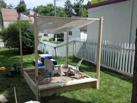 Sandbox I made with a roll away shade cover. Sandpit Shade Ideas, Diy Sandbox With Canopy, Sandbox Shade Ideas, Diy Large Sandbox With Cover, Sandpit Ideas, Sandbox With Canopy, Playground Shade, Sandbox Plans, Kids Shed